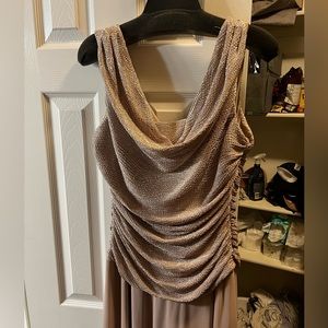 Beautiful gold formal dress with glittery top and solid skirt.